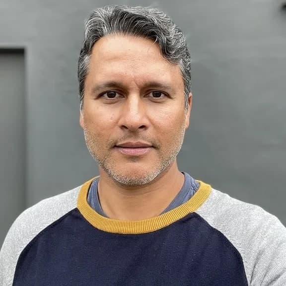 I'm Rajesh — a nature boy / tech bro based in San Diego, coding by day and shooting by night, doing both mostly solo. I shoot on a Leica Q3 and an old Yashica TLR when I want to slow down. The gallery here spans street, landscape, and the in-between — the small intervals where a place rearranges itself for the light.